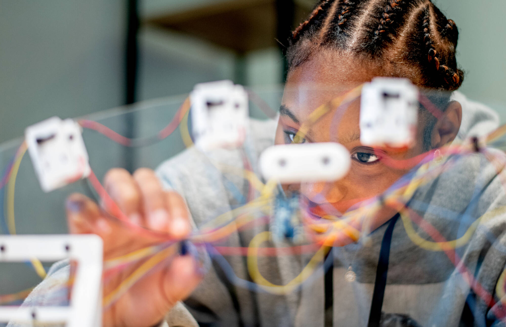 Kamya Greer experiments with tech in the Atomic Object Technology Showcase during the student interactive activities as part of the REP4 2025 Learner Design Summit July 23.